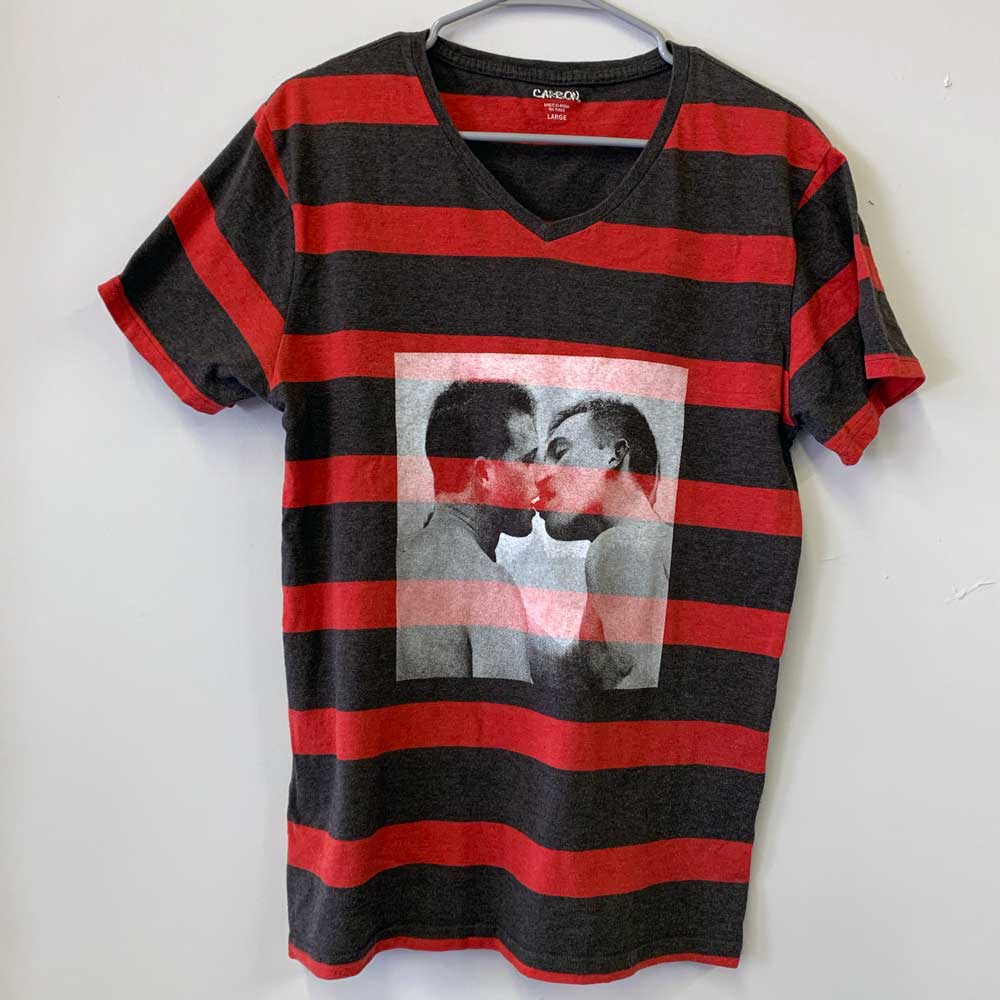 red and black striped V-neck with white artwork